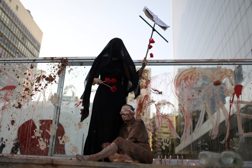 Activists attend a protest in front of the Brazilian mining company Vale SA headquarters in Rio de Janeiro